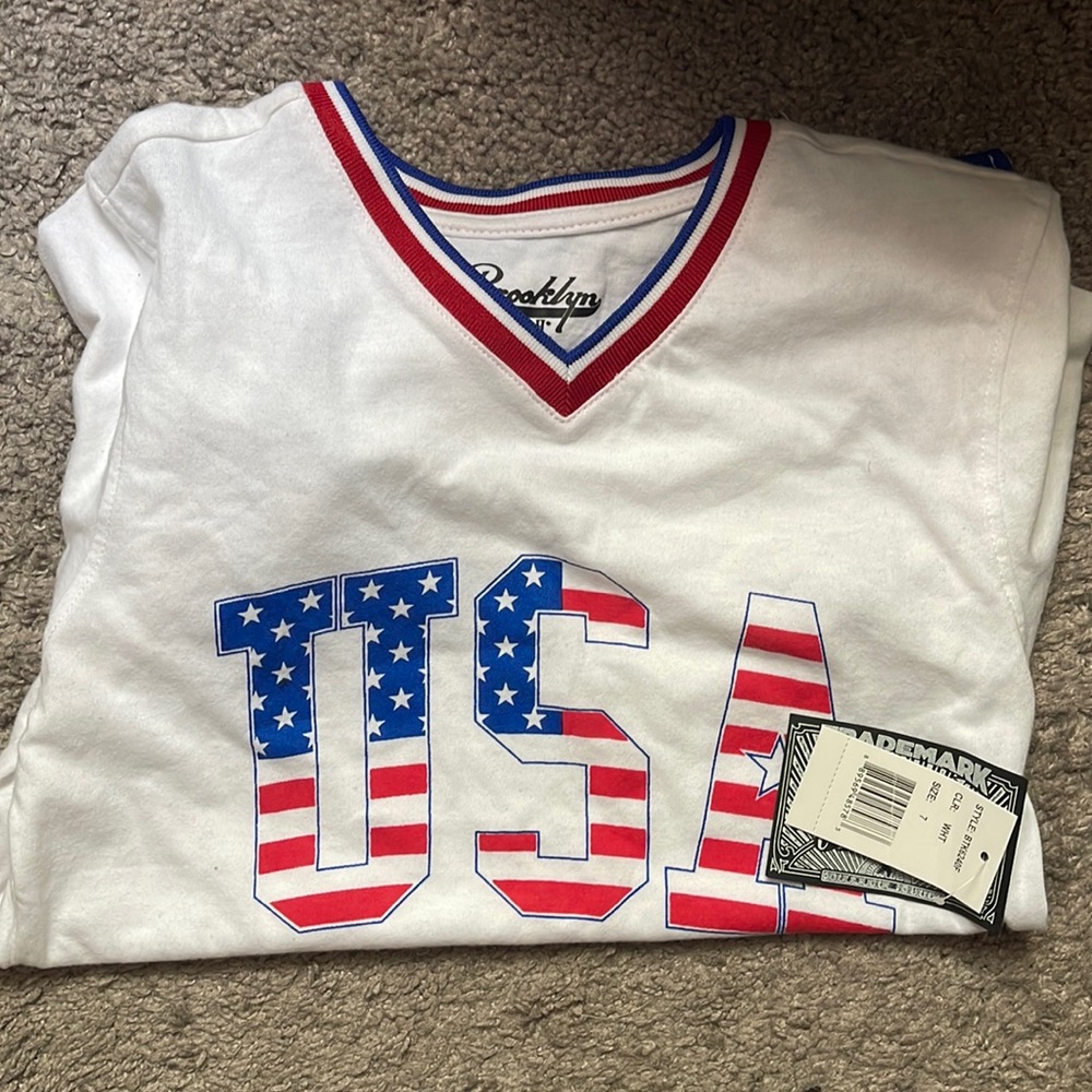 Brand new boys six 7 white shirt with USA on it. Other colors red and blue